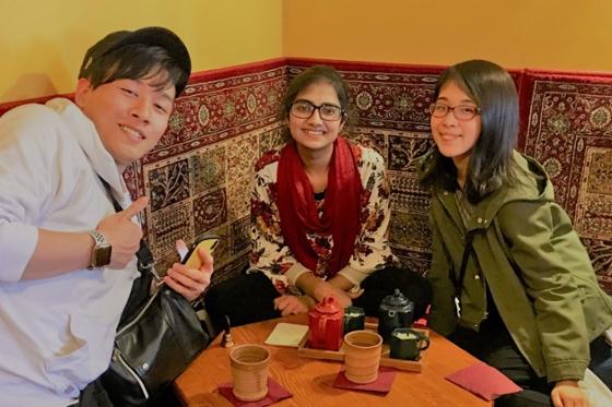 Photo of three international students posing in a 匹兹堡 tea shop